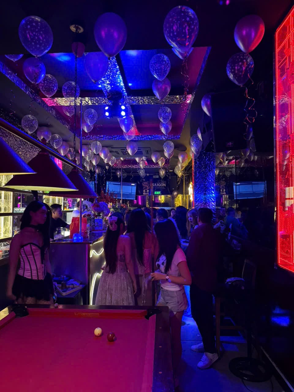 Guests playing pool at Honey Bar