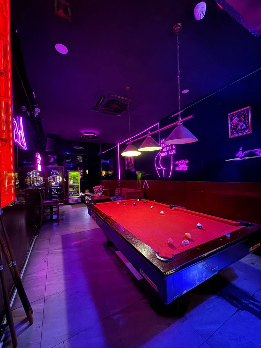 Pool room with neon at Honey Bar Saigon